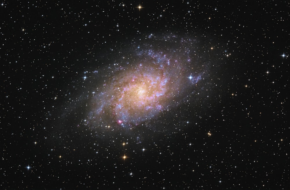 a spiral galaxy with stars in the background