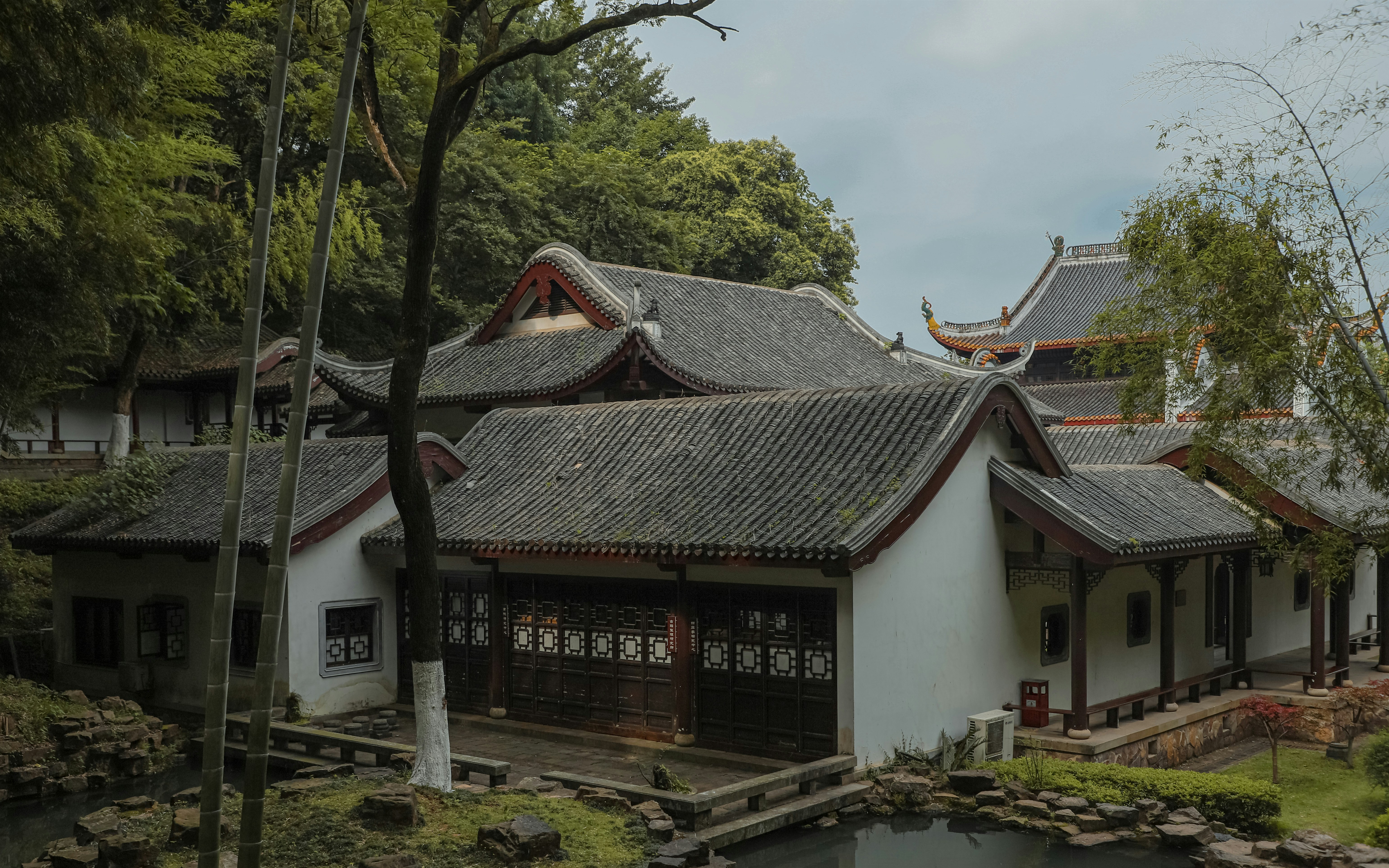 a building with a pond in front of it