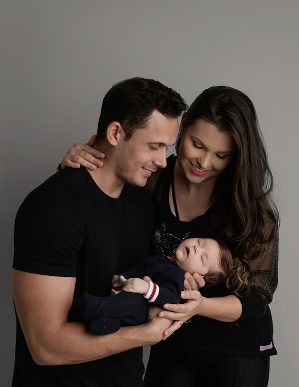 Mother holding newborn baby close