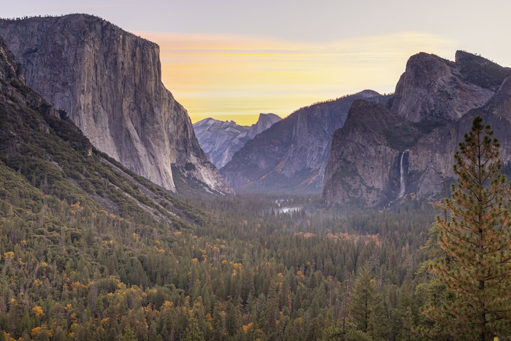 a view of a valley with mountains in the background