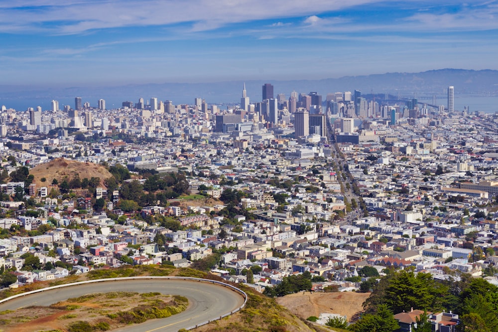 a view of a city from the top of a hill