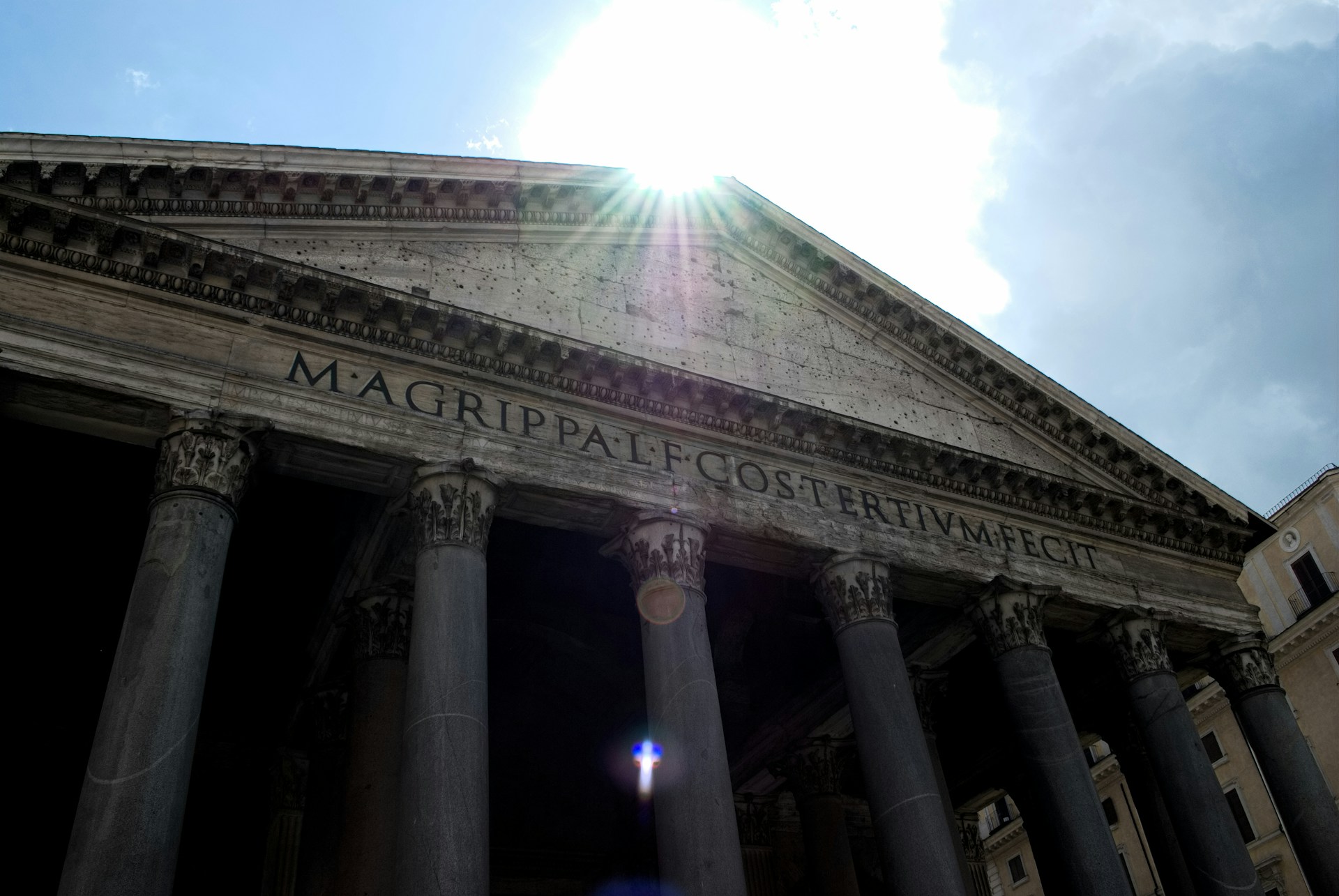 the sun shines brightly on the front of a building