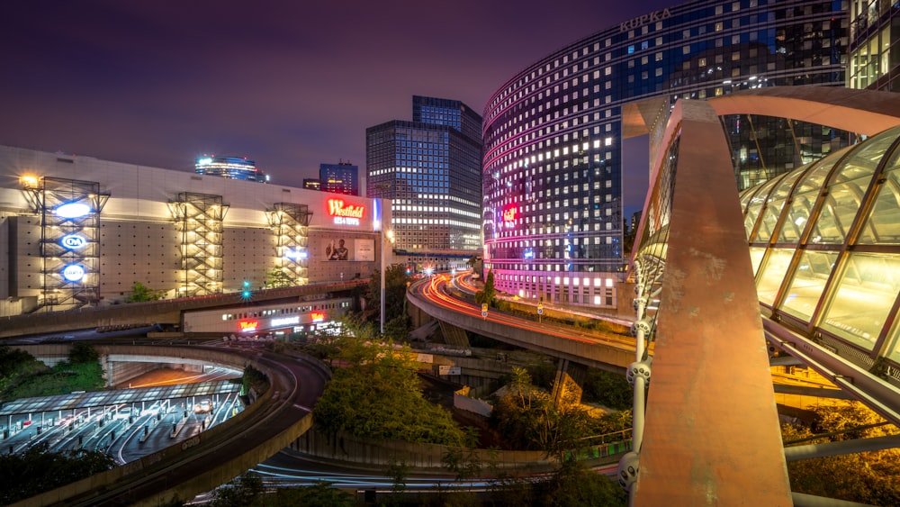 a view of a city at night from a bridge