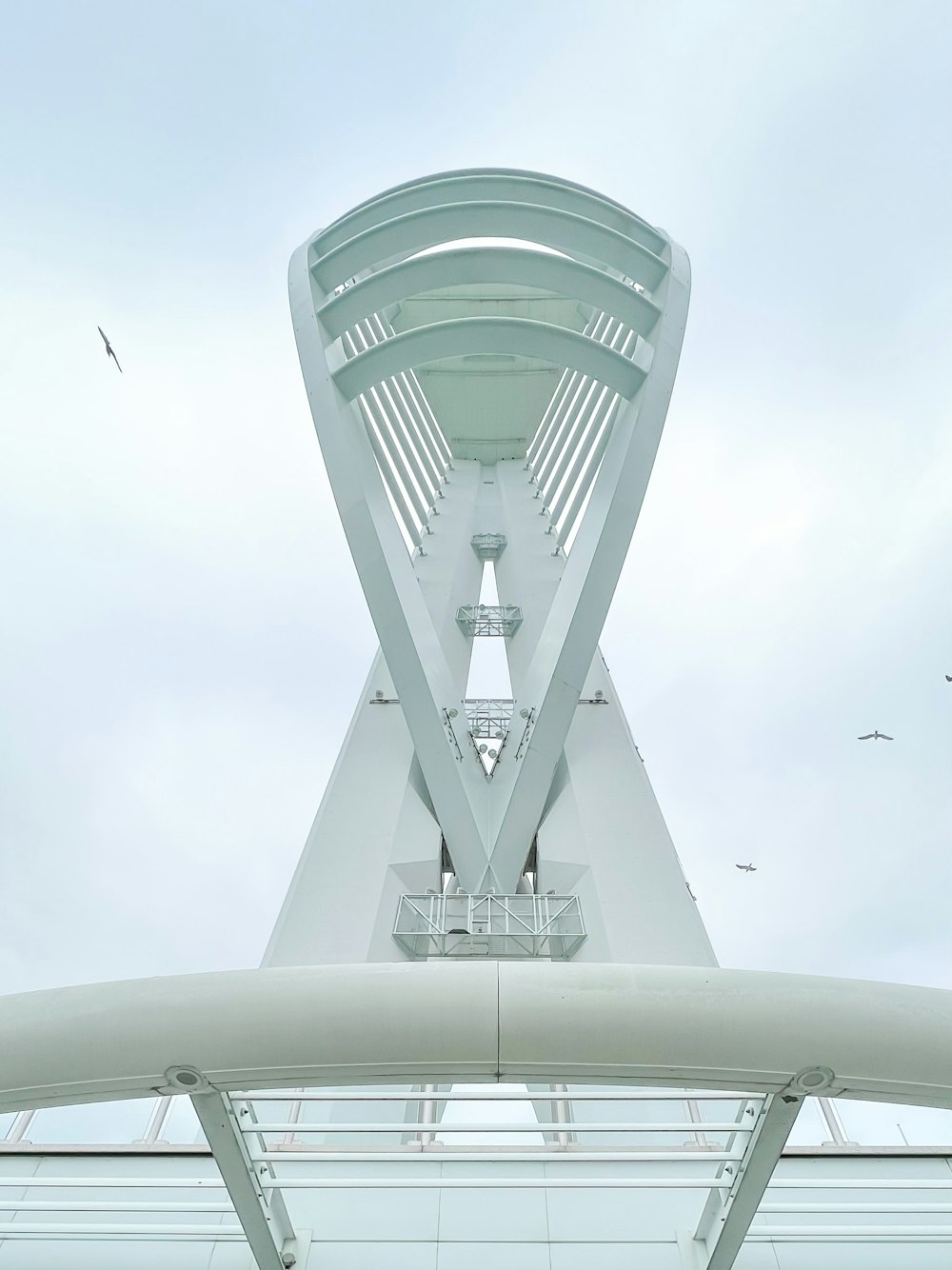 a very tall white structure with a sky background