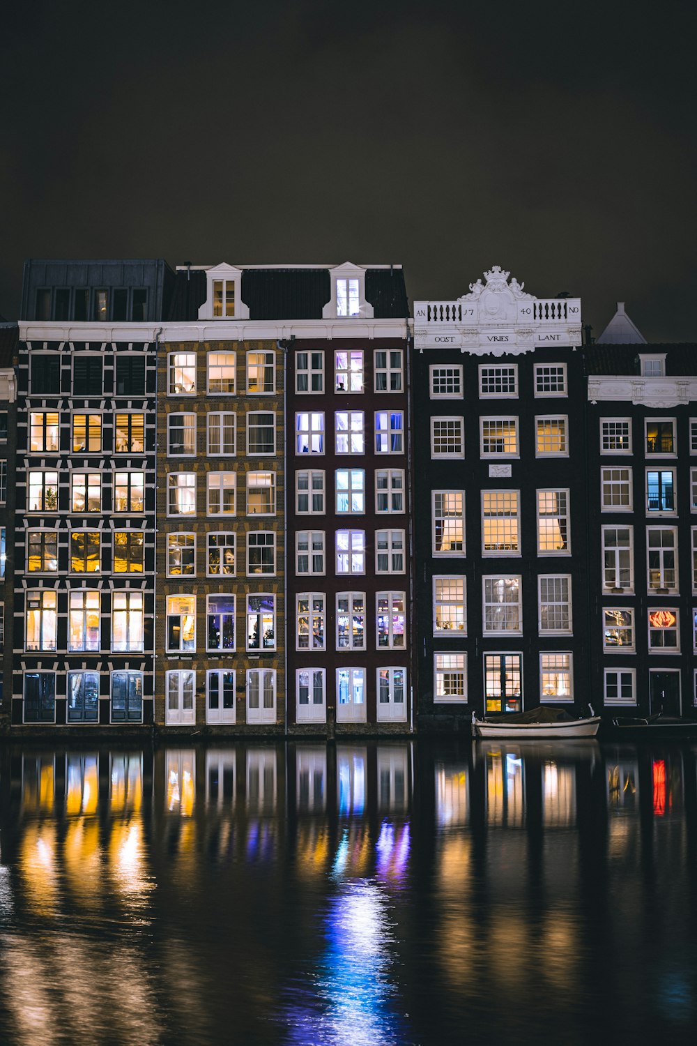 a group of buildings that are next to a body of water