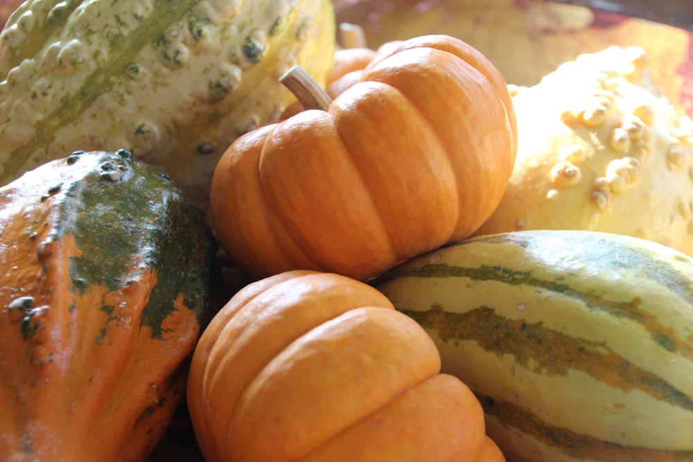 a group of pumpkins sitting on top of a table