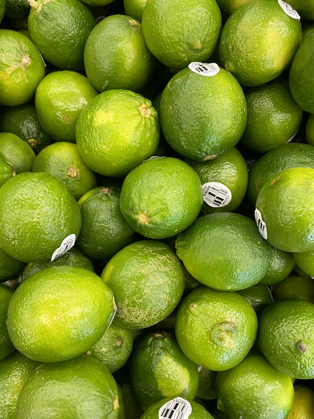 a pile of limes sitting next to each other