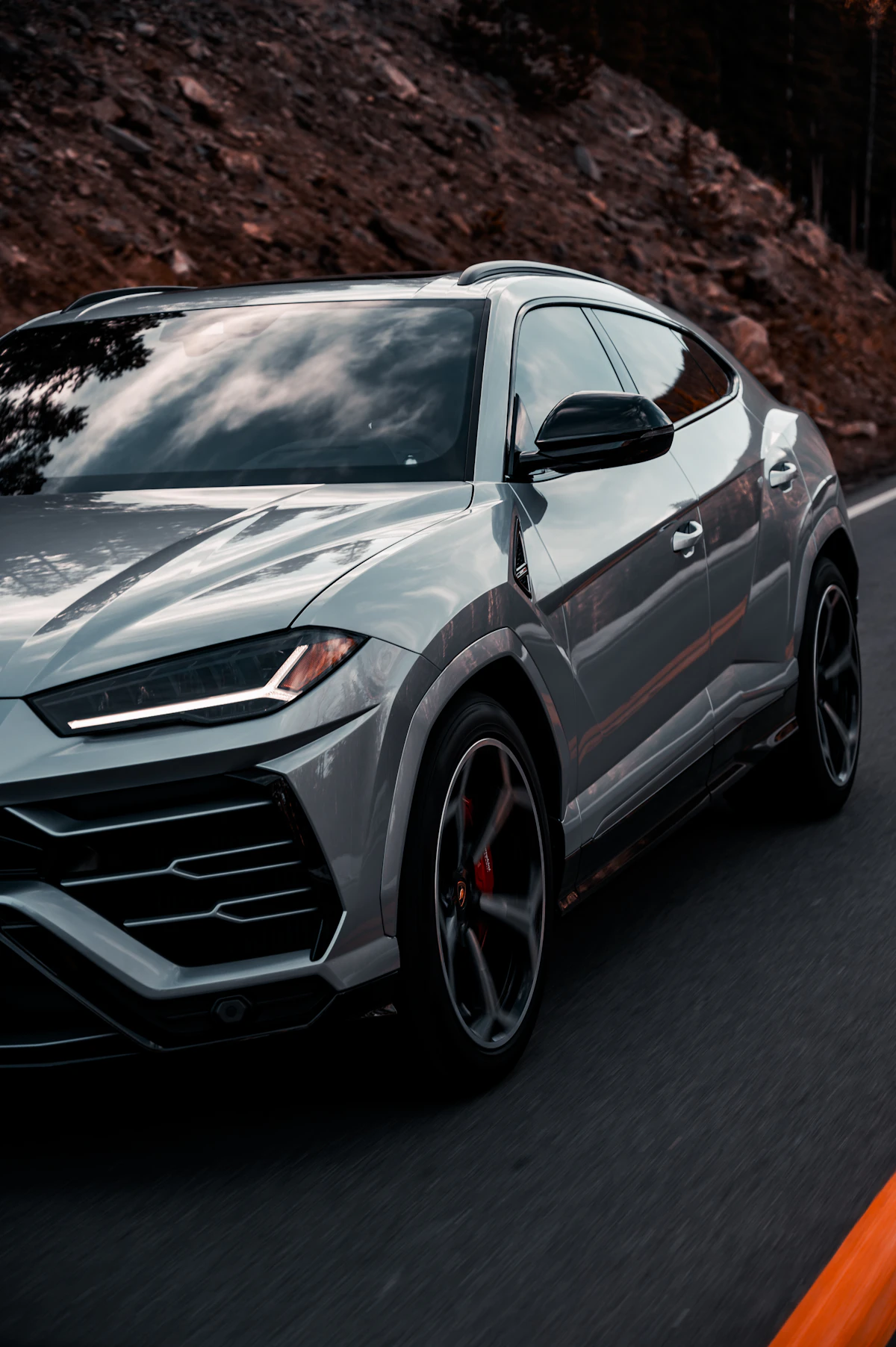 Performance SUV driving on a mountain road