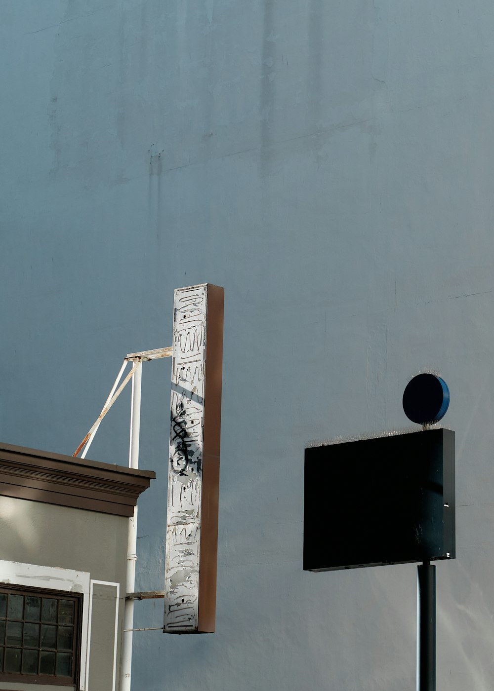 a street sign next to a blue building