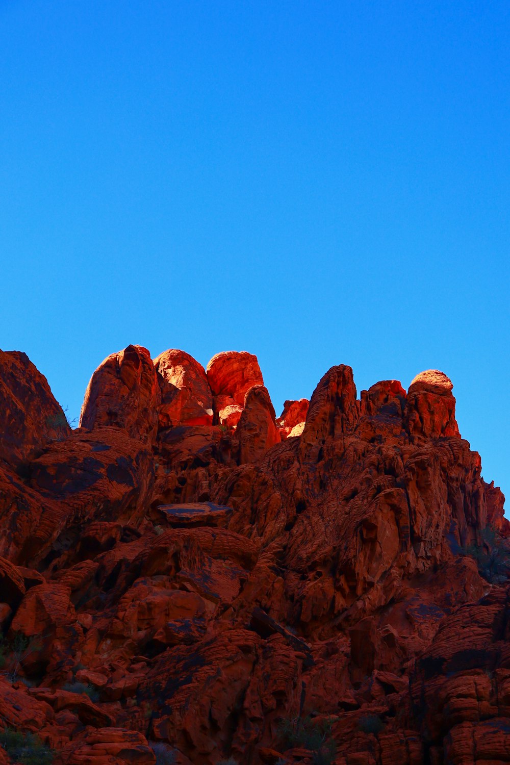 a large mountain with a sky background