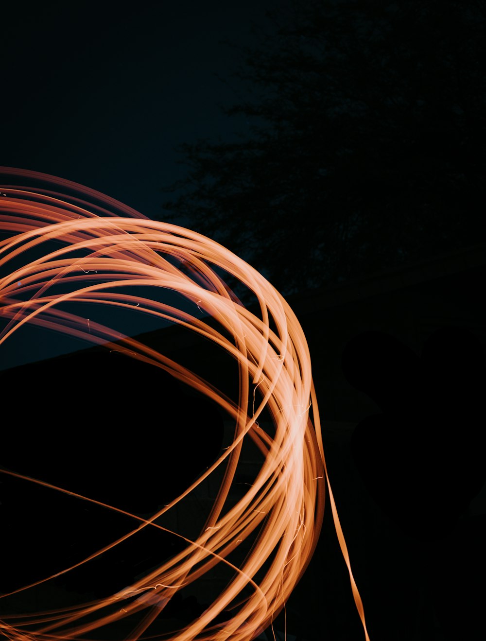 a long exposure of a fire hose on a black background