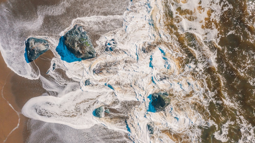 an aerial view of a beach covered in ice