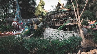 A vibrant dragon curled around ancient ruins, flames glowing softly.