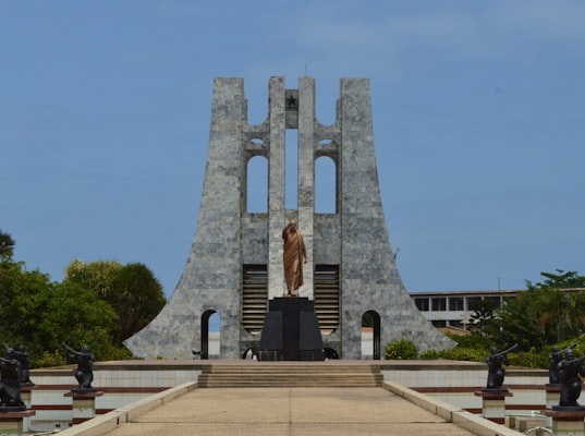 Statue standing in front of a building in Ghana — photo by Ifeoluwa B. on Unsplash