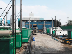 a factory with a lot of green and white machinery