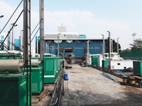 a factory with a lot of green and white machinery