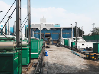 a factory with a lot of green and white machinery