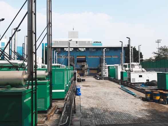 a factory with a lot of green and white machinery
