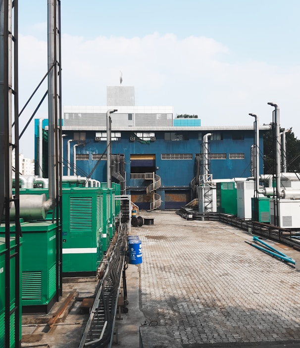 a factory with a lot of green and white machinery