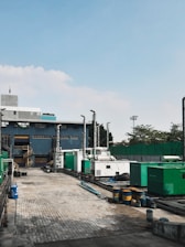 a factory with a lot of machinery in front of it