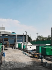 a factory with a lot of machinery in front of it