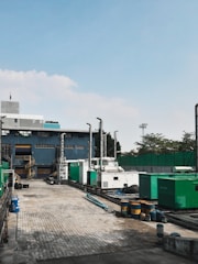 a factory with a lot of machinery in front of it