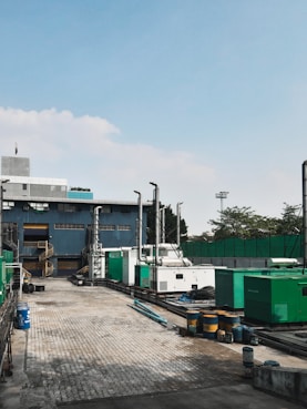 a factory with a lot of machinery in front of it
