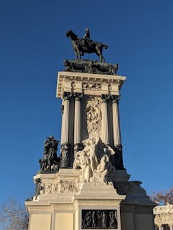 a statue of a man on a horse on top of a building