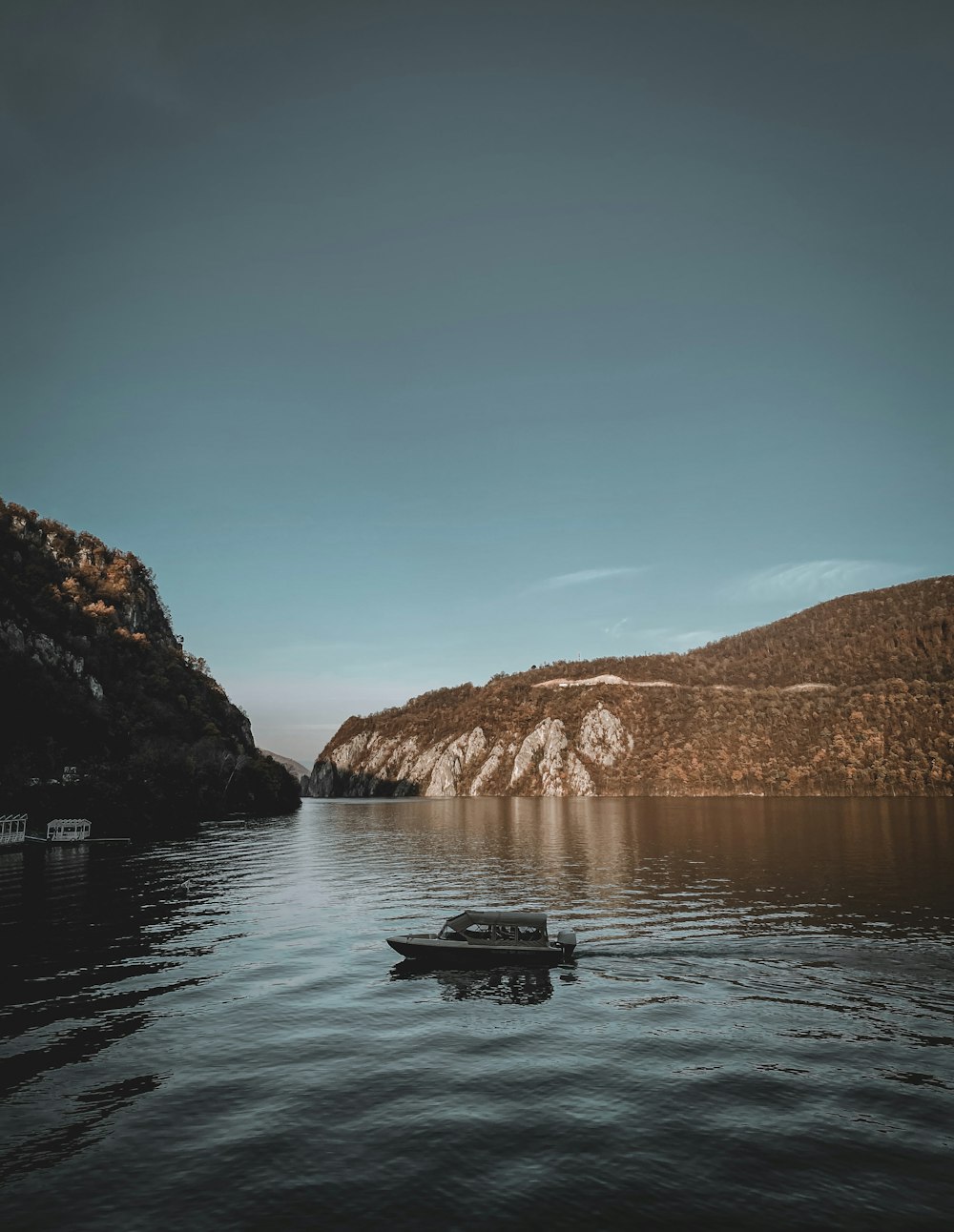 a boat floating on top of a body of water