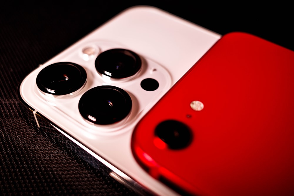 a close up of a red and white cell phone