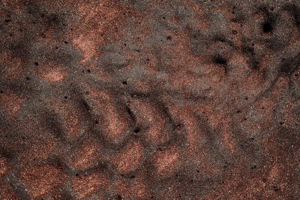 a close up of a dirt surface with a small amount of dirt