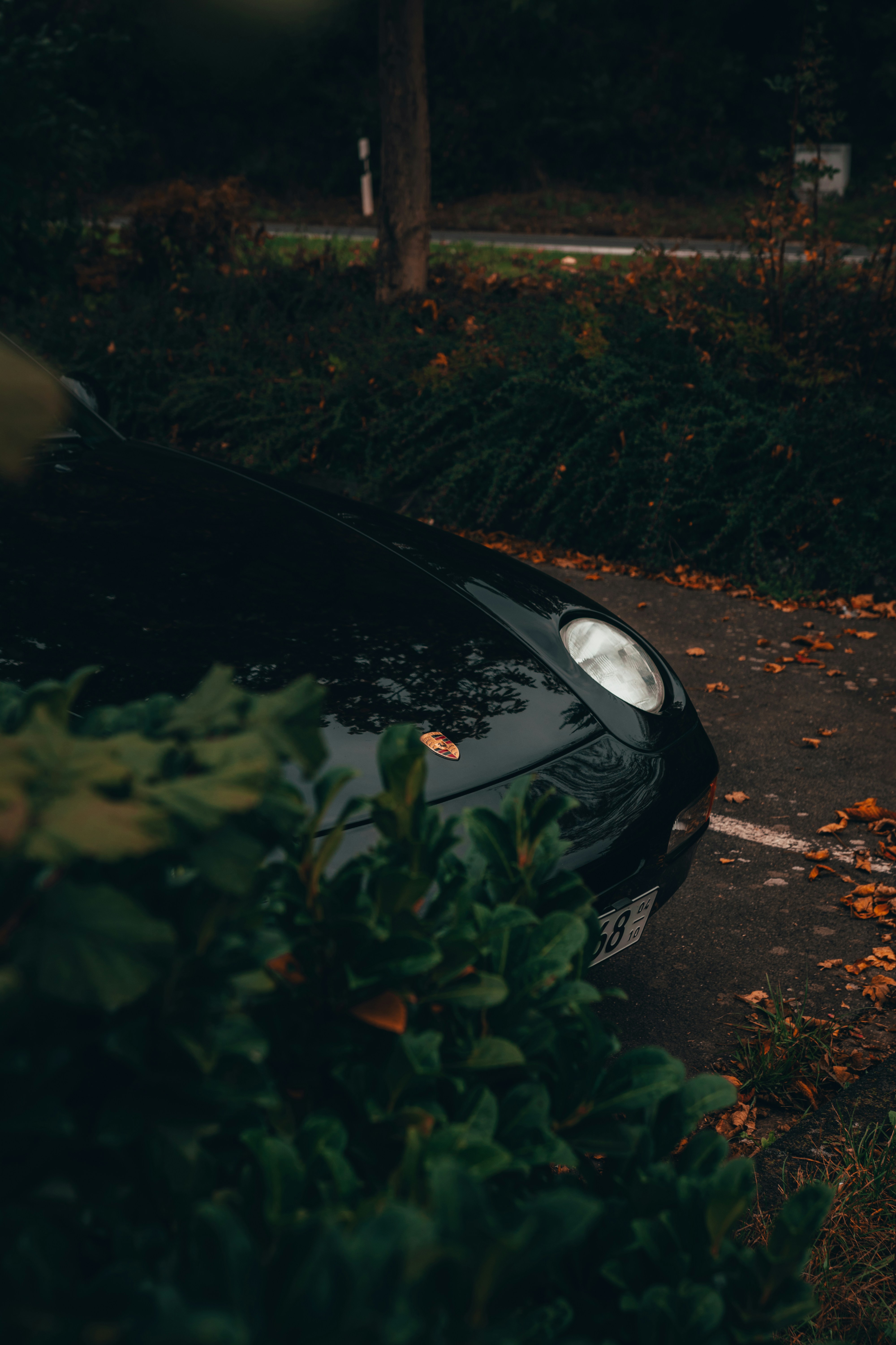 a black sports car parked in a parking lot