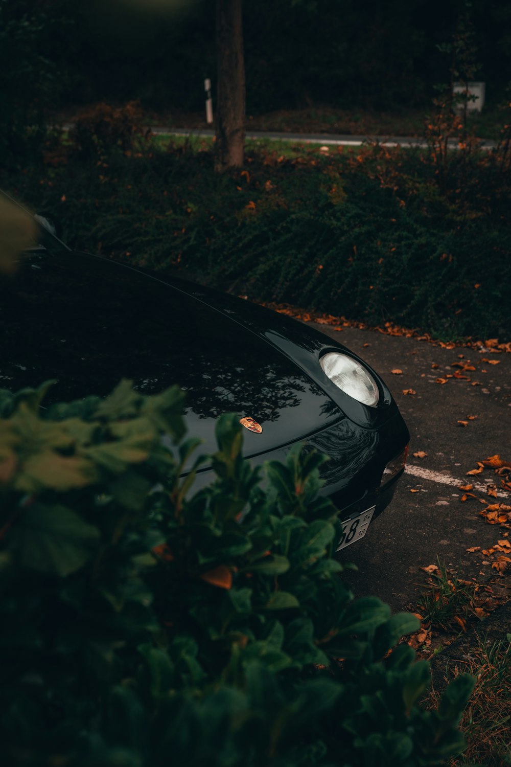 a black sports car parked in a parking lot