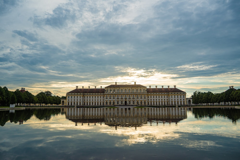 a large building sitting on top of a lake