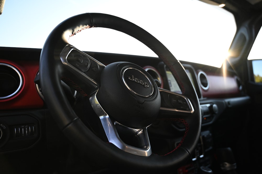 the interior of a car with a steering wheel