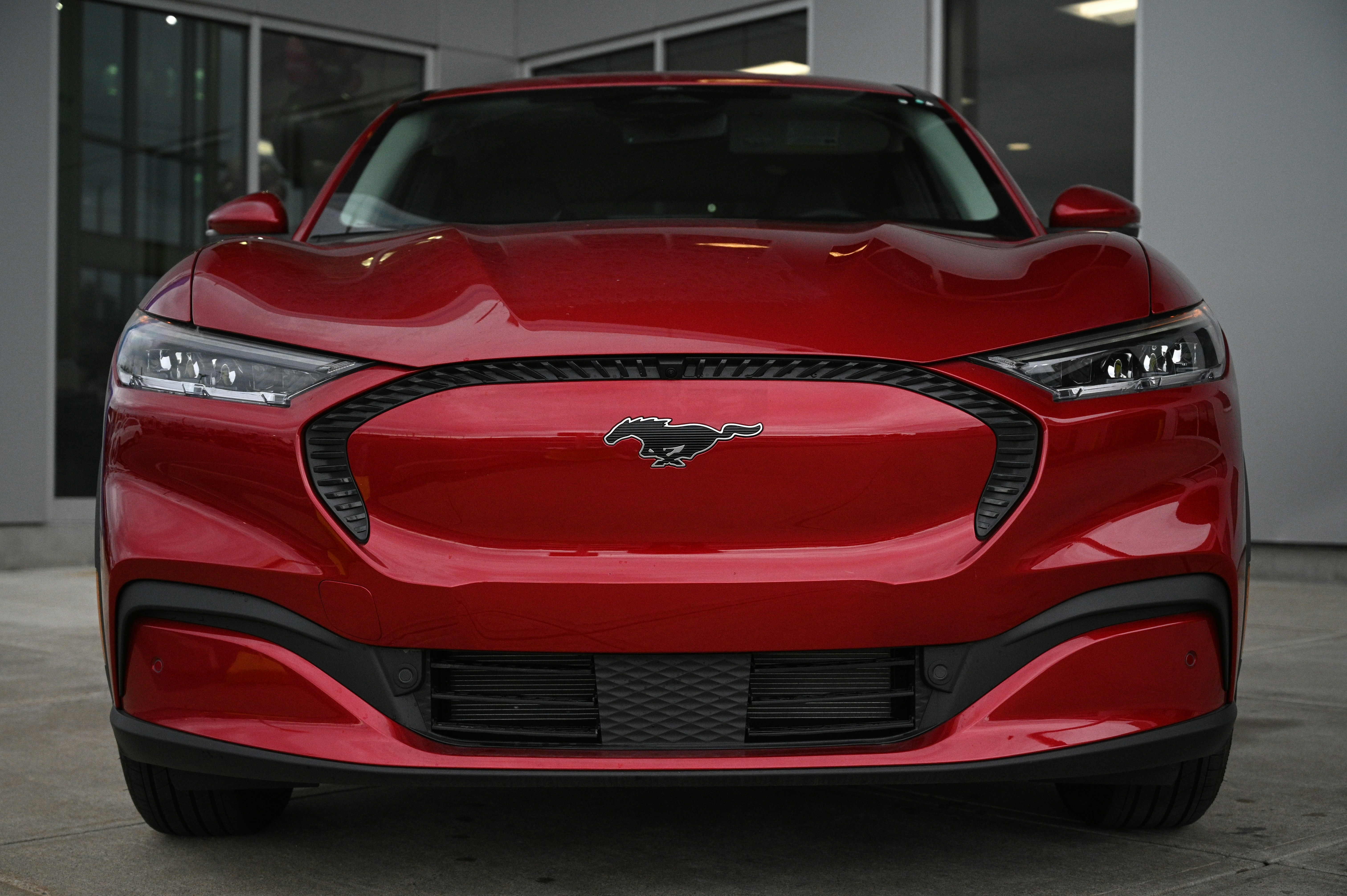 a red sports car parked in front of a building