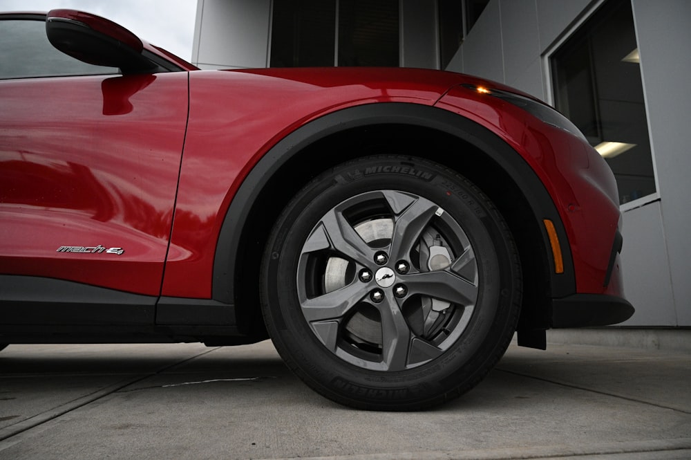 a close up of a tire on a red car