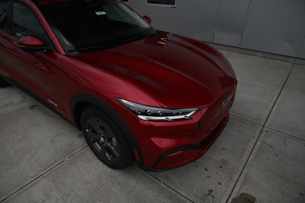a red sports utility vehicle parked in a garage