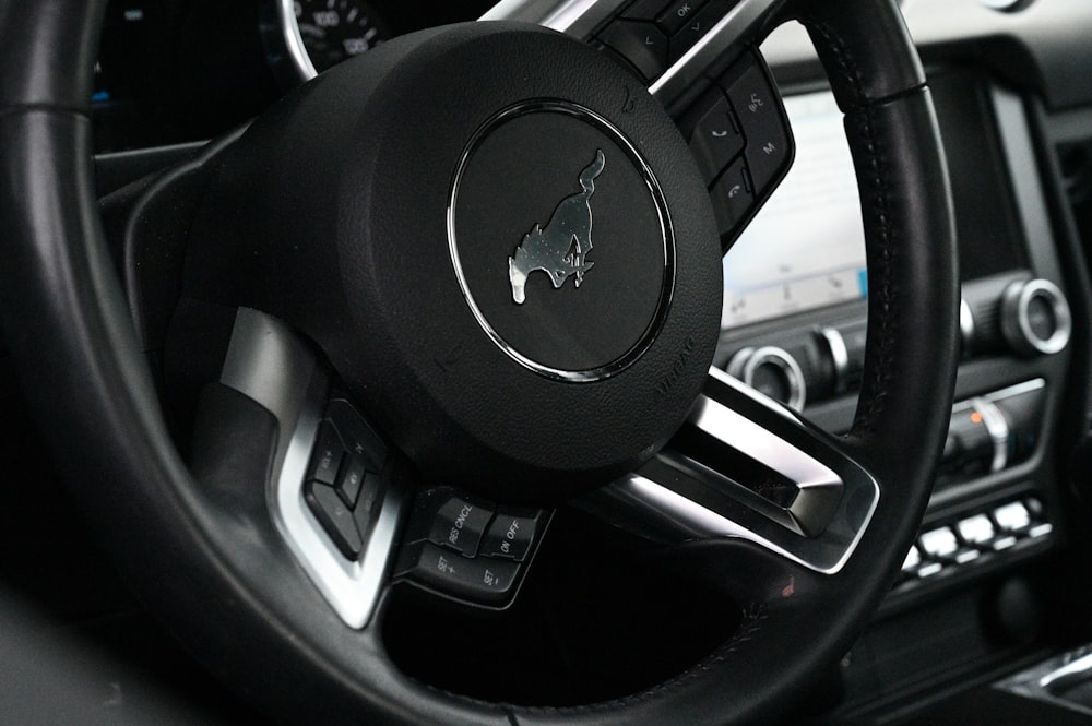 a steering wheel and dashboard of a car