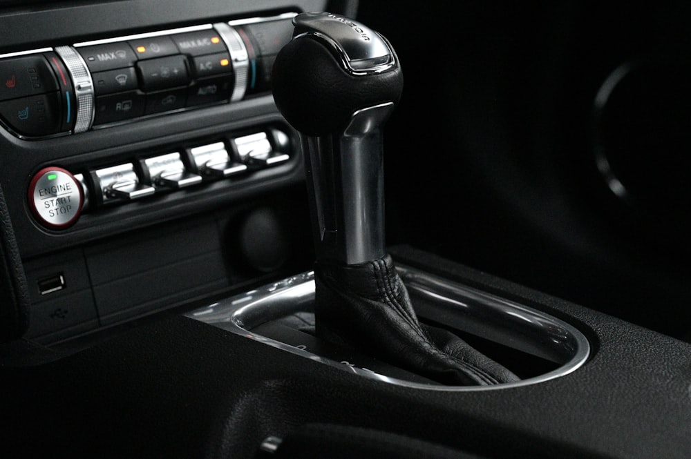 a close up of a car radio with a steering wheel
