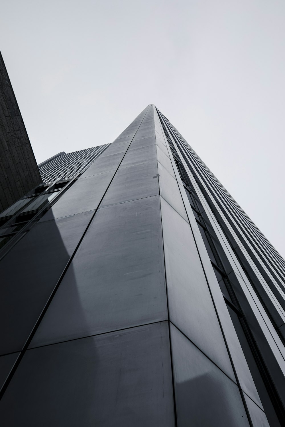 looking up at the side of a tall building