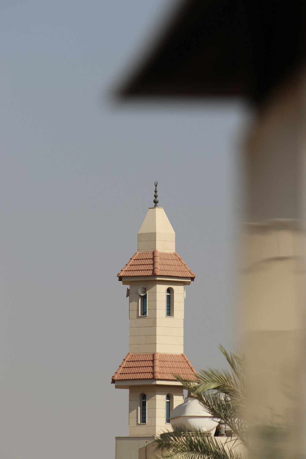 a tall tower with a clock on the top of it