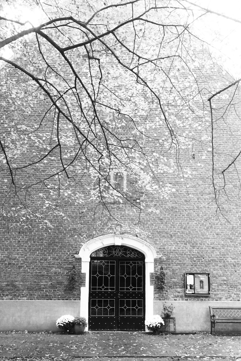 a black and white photo of a brick building