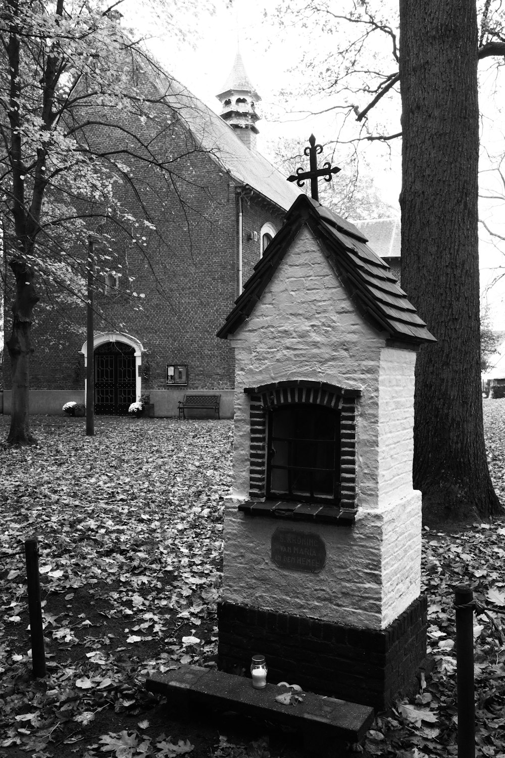 a black and white photo of a small church