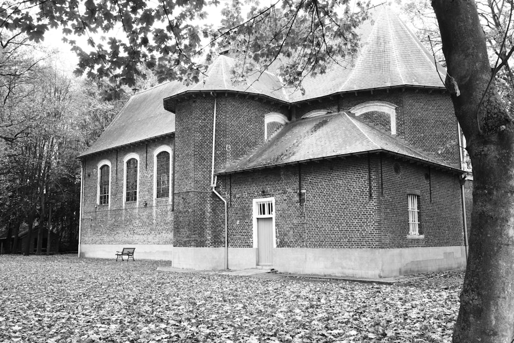 a black and white photo of an old church