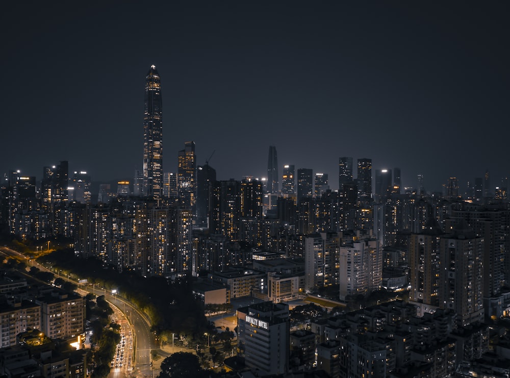 a night view of a city with a lot of tall buildings