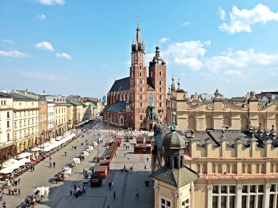 Krakow's Main Market Square with St. Mary's Basilica and the medieval Cloth Hall at golden hour