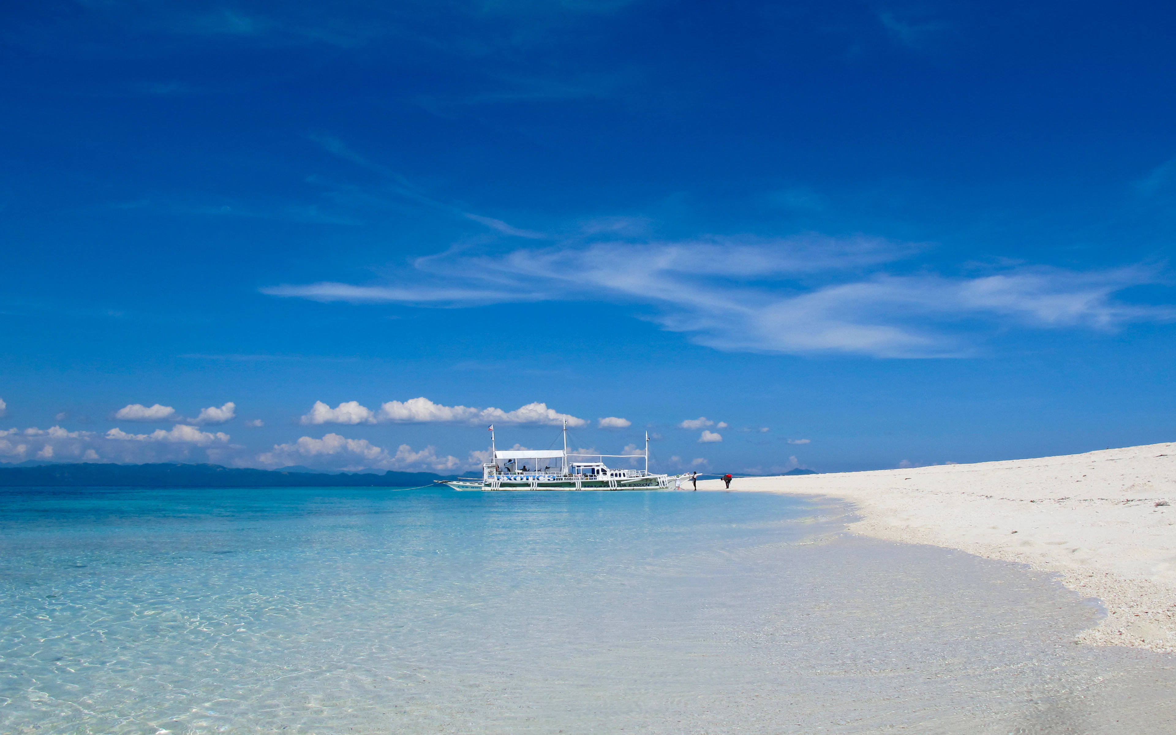 A white beach and shallow sea