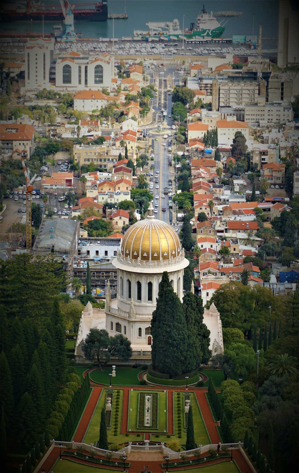 an aerial view of a city with a domed building