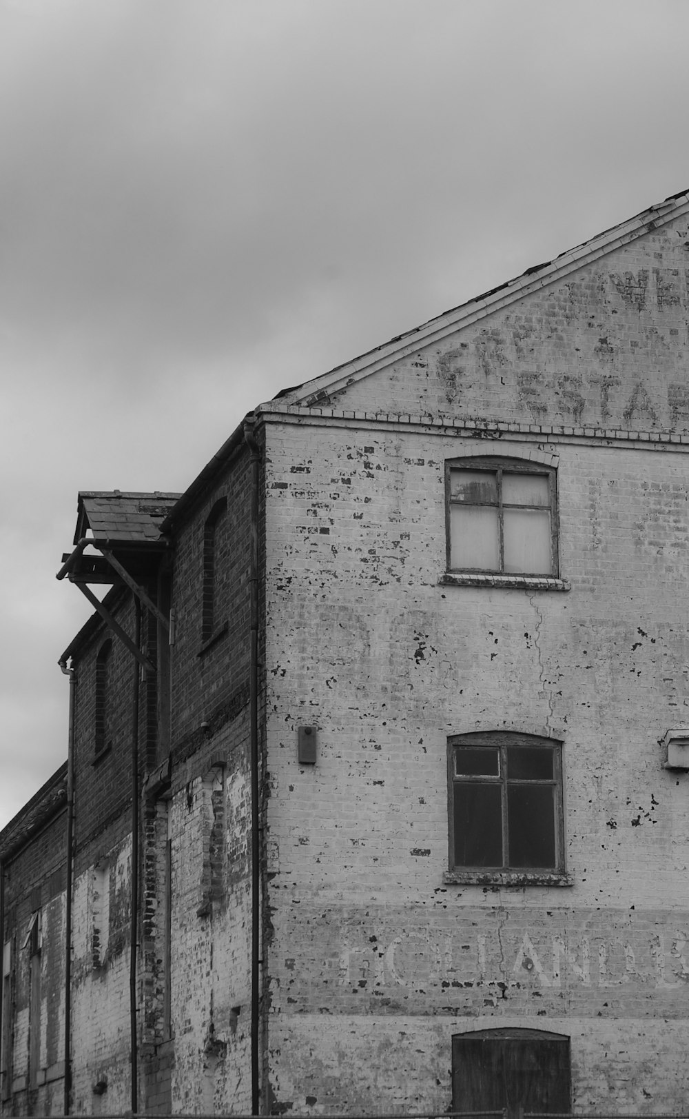 a black and white photo of an old building